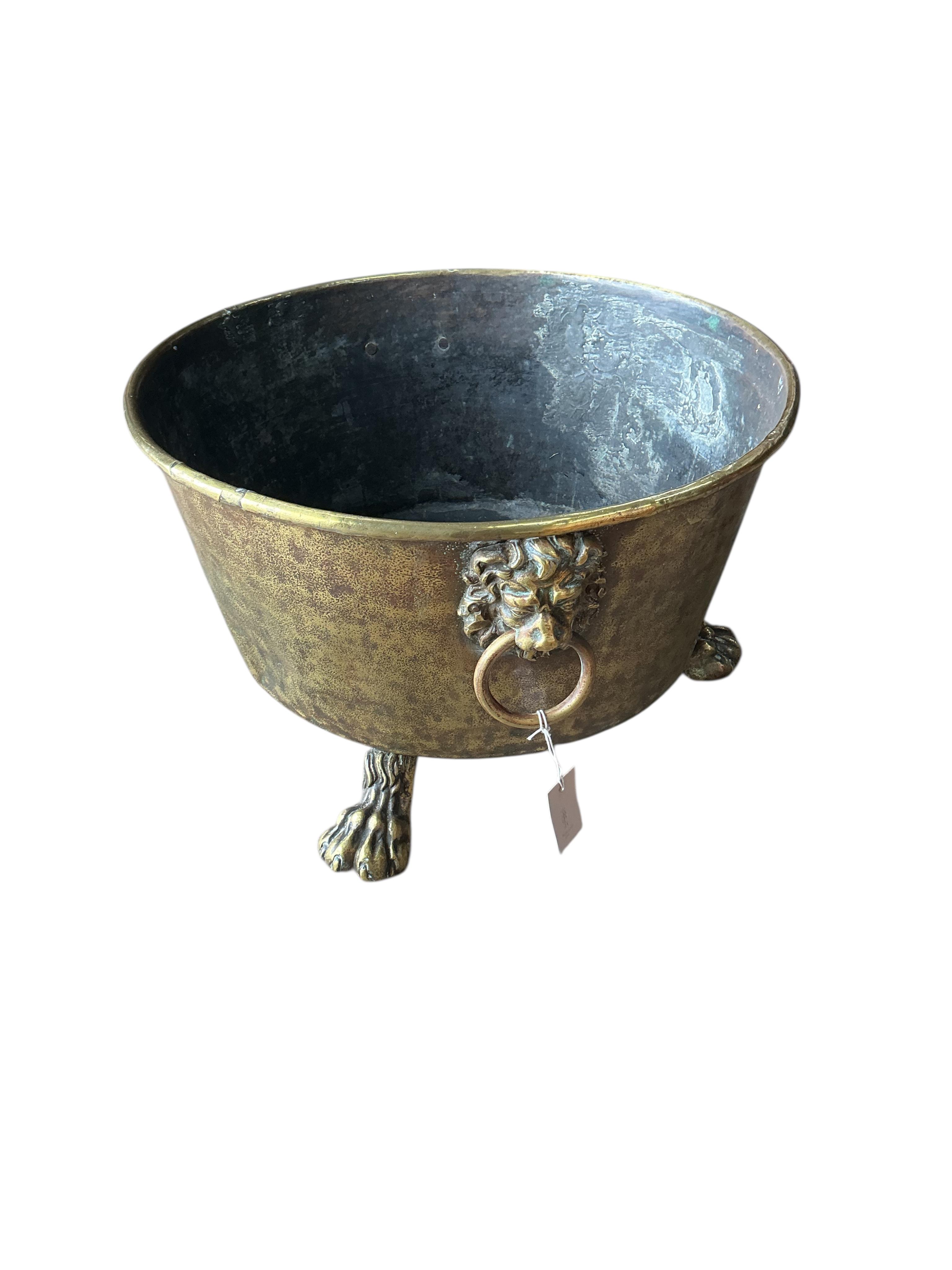 A circular brass log bin, diameter 56cm, height 34cm